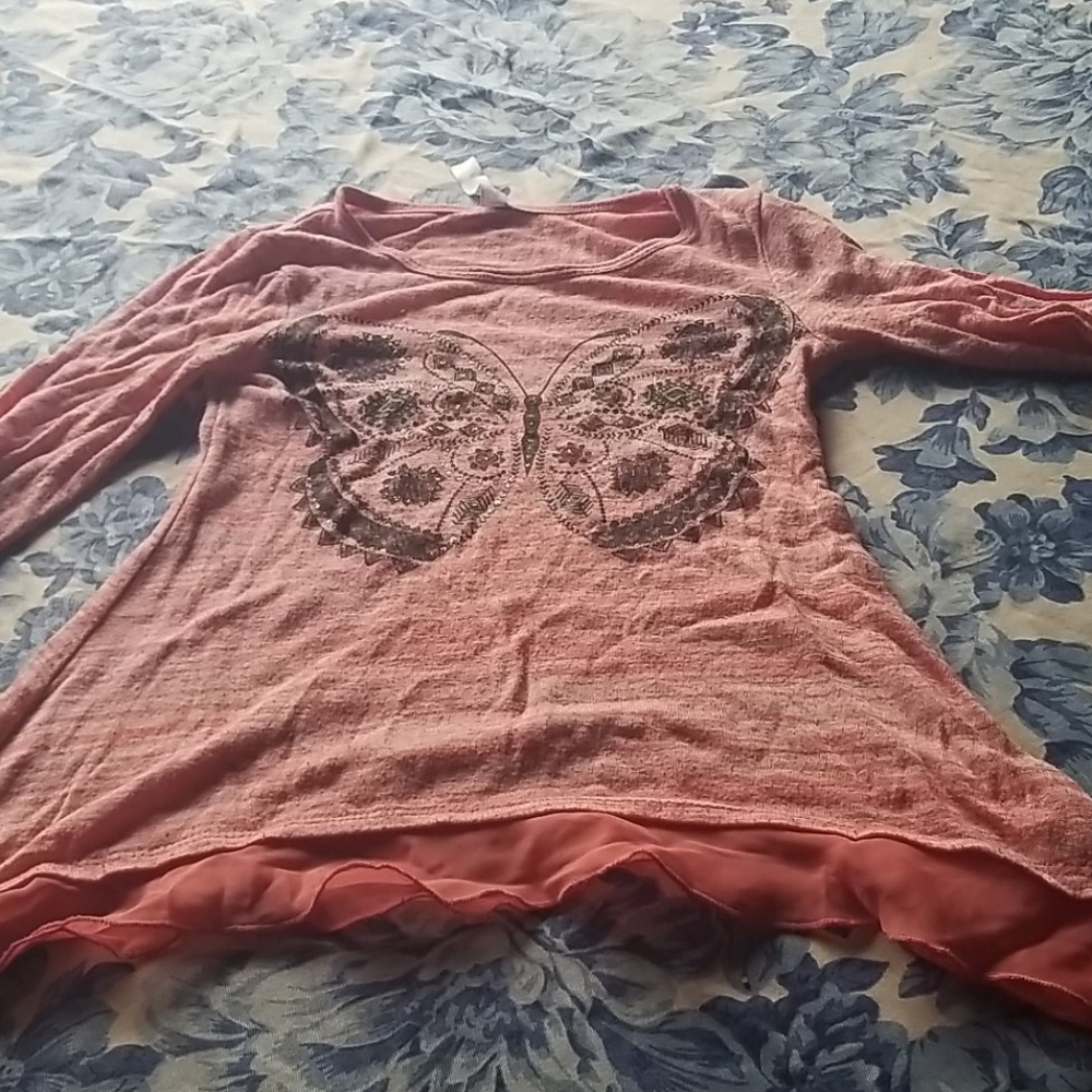 A pink long sleeve shirt